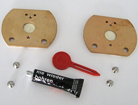 Contents of the No Drill Adaptor Kit showing the adhesive, mounting pads, tool, and mounting screws.